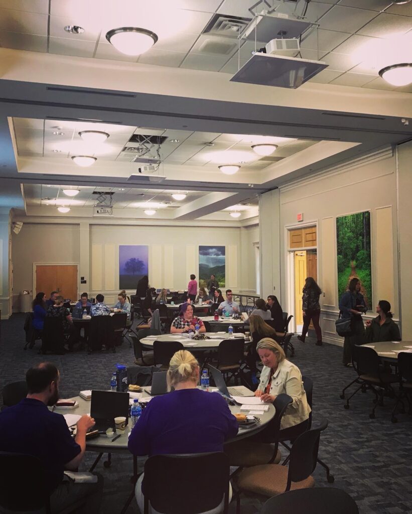 Image of in-action workshop in large space.